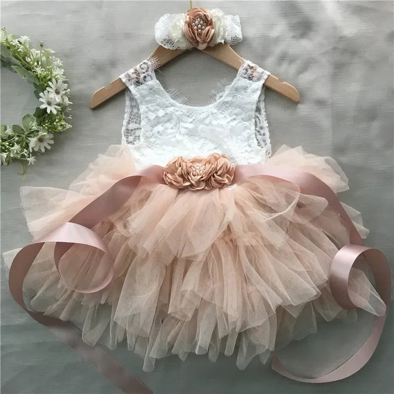 Elegant girls’ beaded lace top with blush tulle skirt, floral belt and headband 3-piece set.