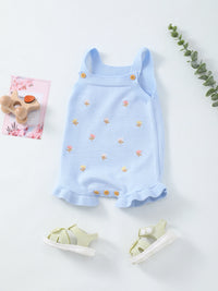 Light blue knit baby romper with tiny floral embroidery, frilled hem, sleeveless straps, and buttoned leg openings.