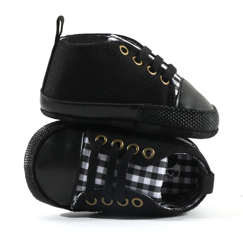 Stylish Black Plaid Baby's Canvas Lace-up First Walkers with a soft cork sole, ideal for early walkers.