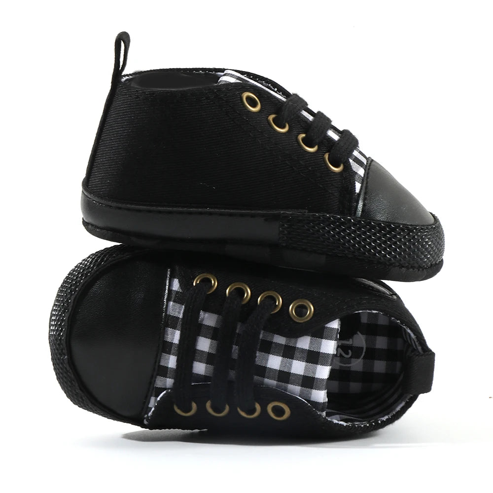 Baby's Canvas Lace-up First Walkers in Black Plaid, perfect for infants learning to walk, featuring breathable canvas upper and soft cork sole for comfort and support.