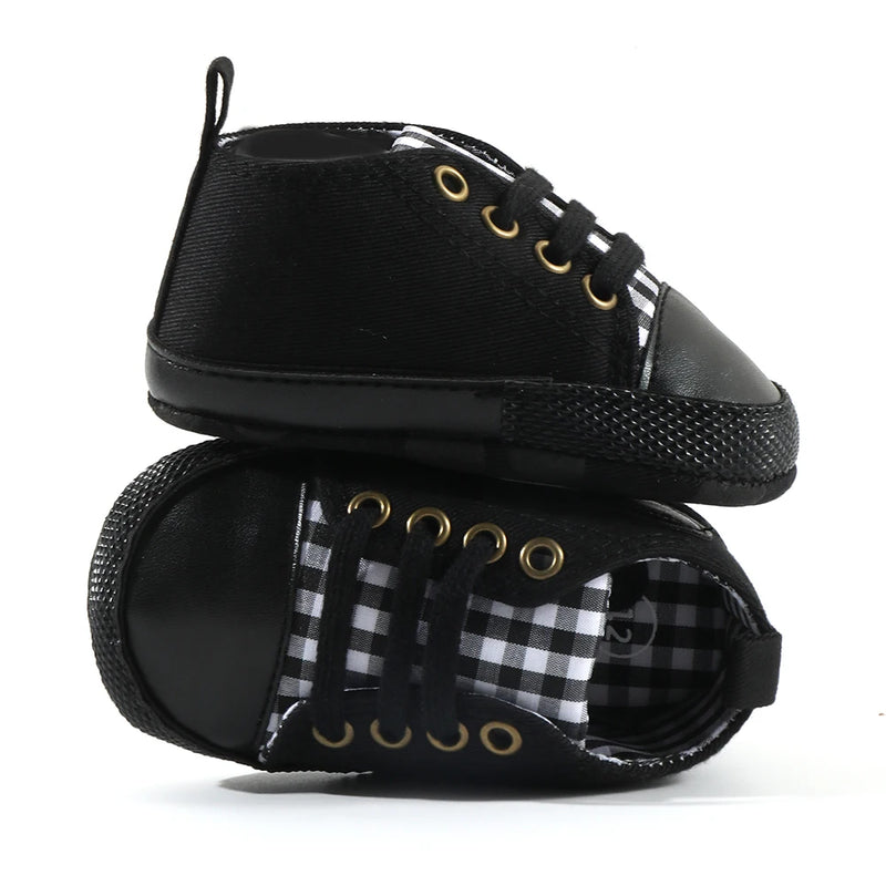 Baby's Canvas Lace-up First Walkers in Black Plaid, perfect for infants learning to walk, featuring breathable canvas upper and soft cork sole for comfort and support.