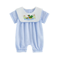 Little Ducky bibbed seersucker romper in blue stripes with white bib and embroidered mallard ducks.