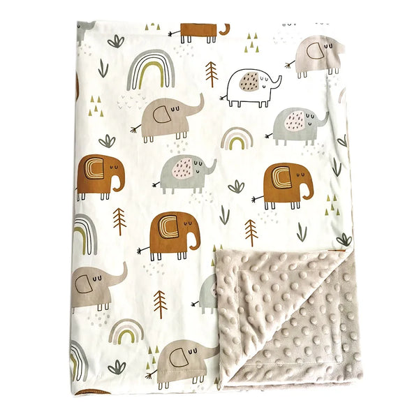 Soft baby blanket with cute elephant, rainbow, and tree print. Features cozy minky dot back. Durable blend perfect for nursery, stroller, or gifts.