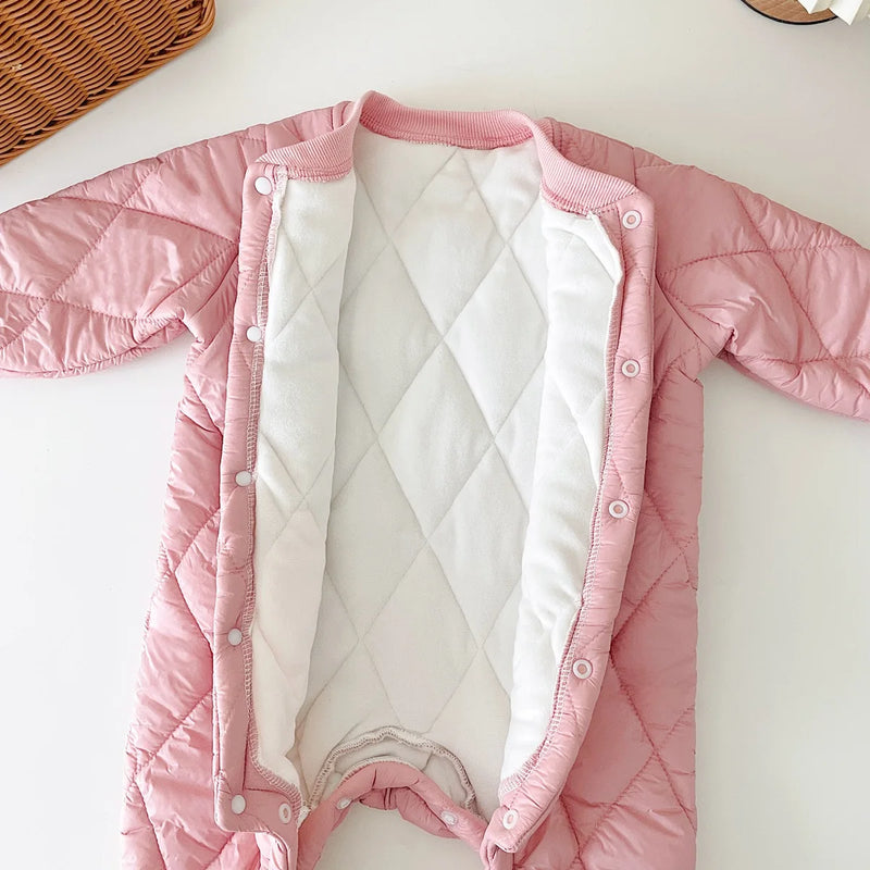 Interior view of a cozy pink baby quilted romper, showing soft fleece lining for maximum warmth and comfort.