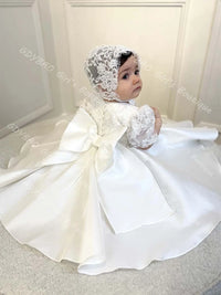 Hannah White beaded lace flower girl gown with matching bonnet, full satin skirt and bow.