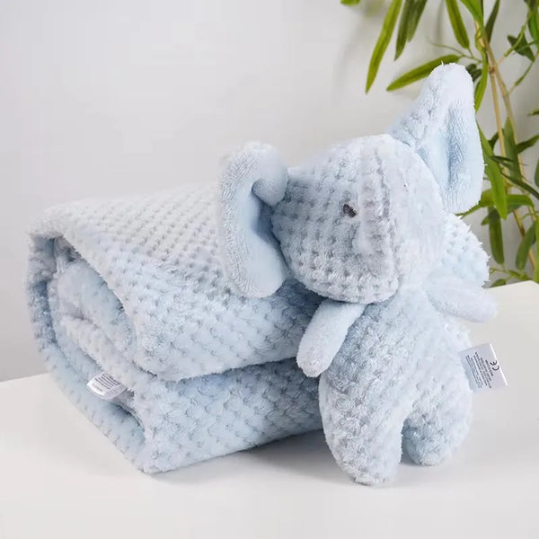 Light blue waffle-knit baby blanket with an attached plush elephant doll.