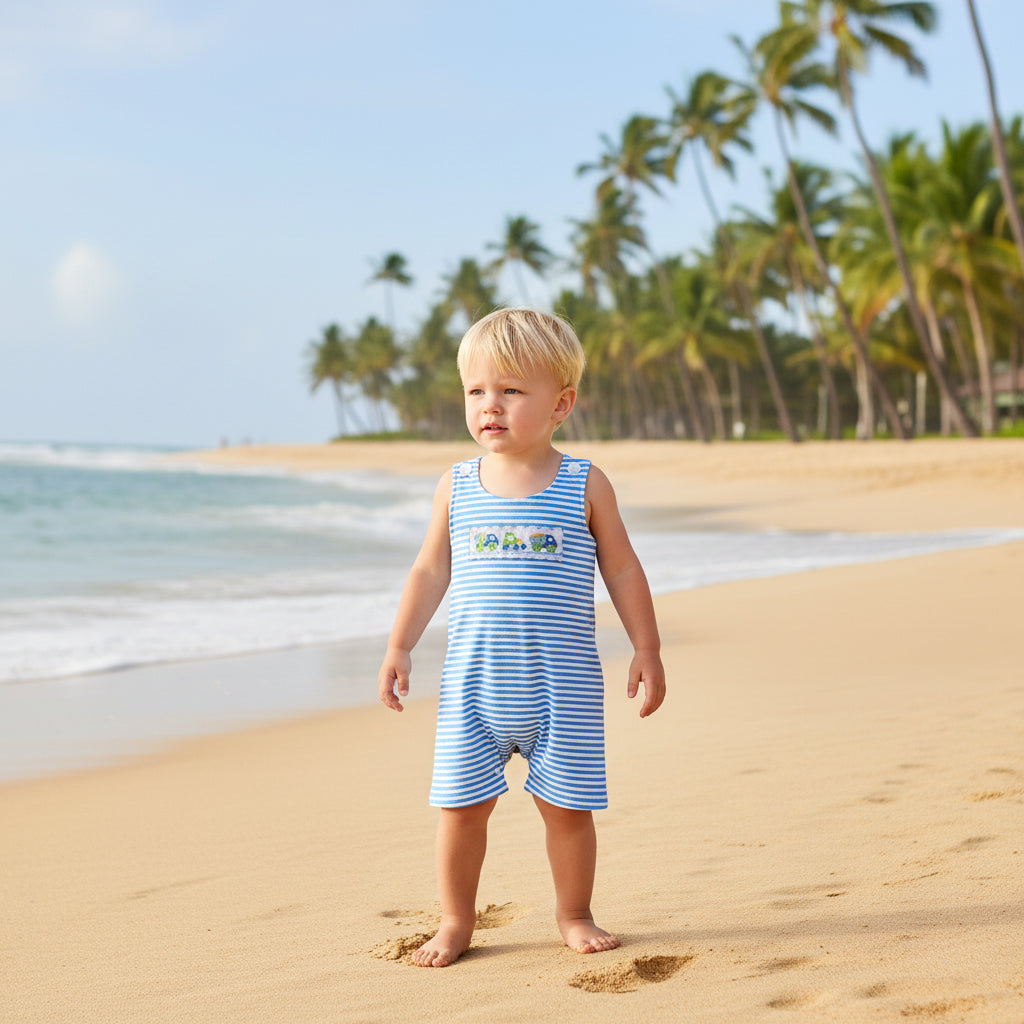 Blue and white striped baby romper with construction-vehicle patch; sleeveless, shoulder snaps, easy diapering.