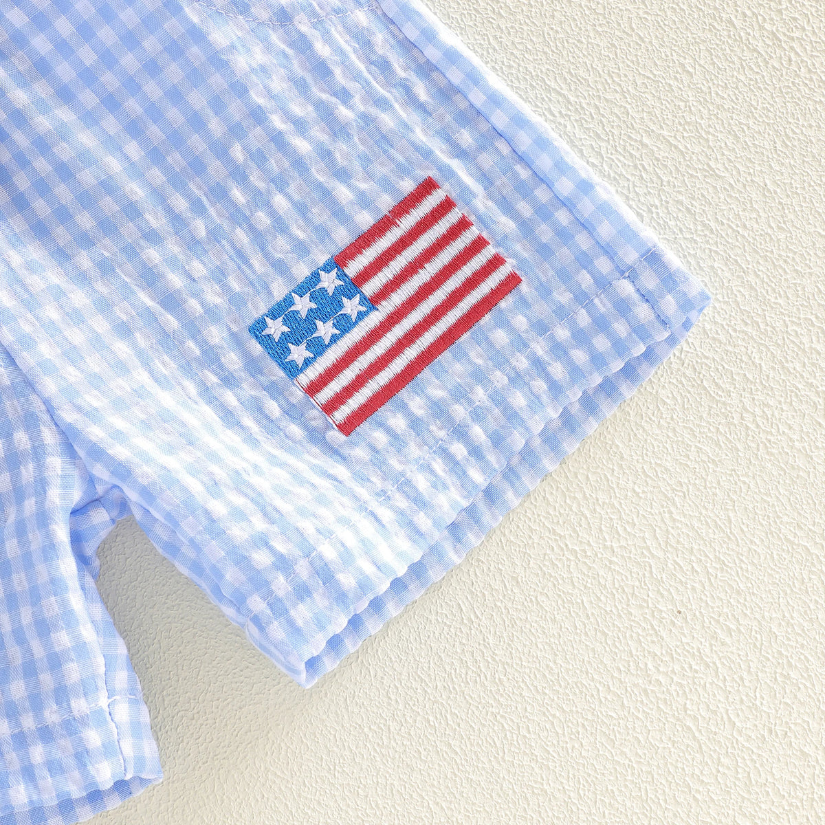 American Boy patriotic polo shirt with United States flag patch on the sleeve.