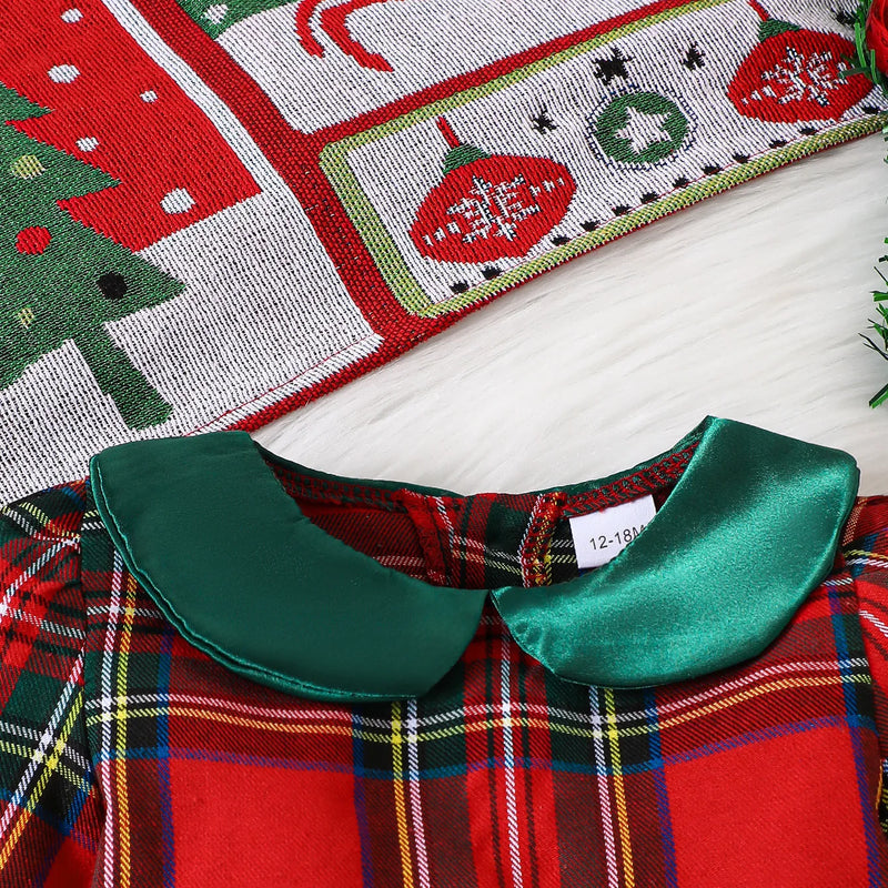 Close-up view of the Peter Pan collar on the Louisa Girls Red Plaid Bow Dress, showcasing the bright green satin trim against the festive plaid design.