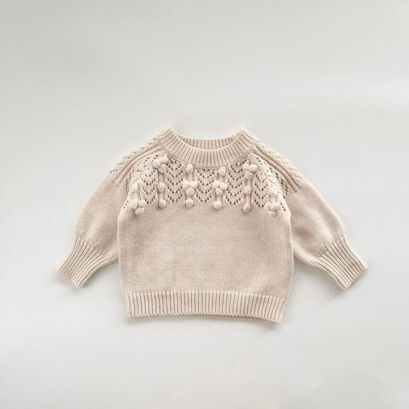 Elegant beige Popcorn Knit Pullover for toddlers, paired with matching toddler skorts, offering cozy charm.