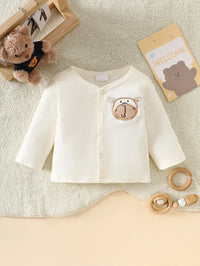 Little Bear beige 8-piece newborn romper set, 100% cotton, bear applique cardigan with front snaps; soft newborn wear.