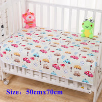 Children's waterproof changing pad with cute car and house prints on a crib, size 50x70 cm.