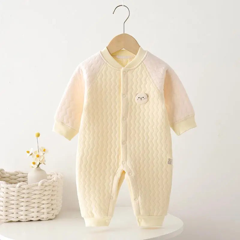 Cozy Warm Baby Quilted Romper in yellow, showcasing a cute design perfect for chilly days.