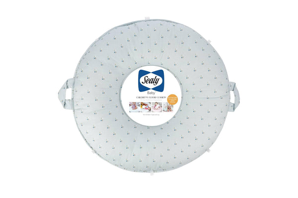 Light gray Sealy floor cushion with small blue and yellow patterns, made of soft fabric with handles