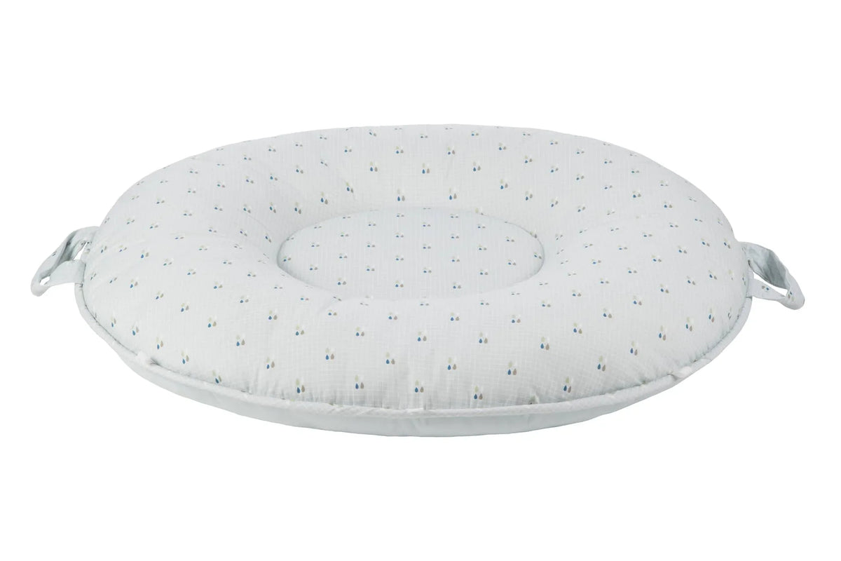 White cotton Sealy floor cushion with small blue and yellow dots and side handles