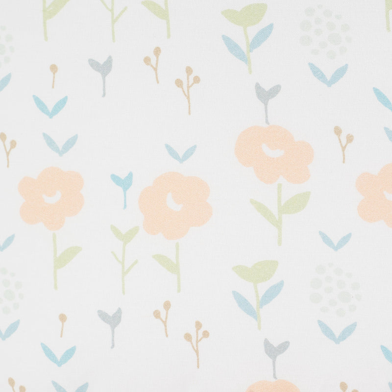 Close-up of the floral pattern on the Sealy Pouf - Coral & Blossoms, showcasing pastel flowers and leaves, ideal for adding charm to a child's space.