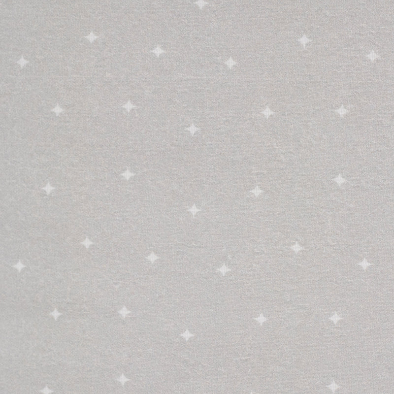 Close-up view of the textured gray fabric featuring a playful dot pattern, showcasing the Sealy Pouf - Gray and Dot Toddlers + Kids, perfect for cozy and stylish children's spaces.