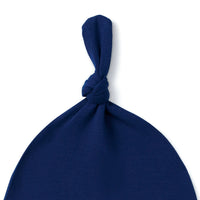 Close-up of navy blue bamboo rayon fabric twisted knot detail