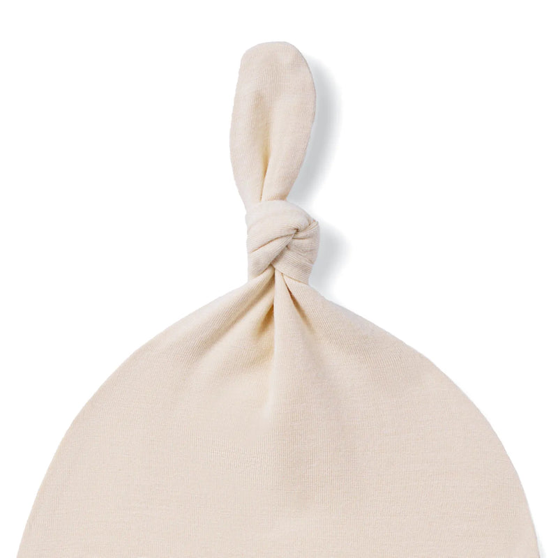 Close-up of twisted crown knot and textured weave on sand bamboo rayon hat