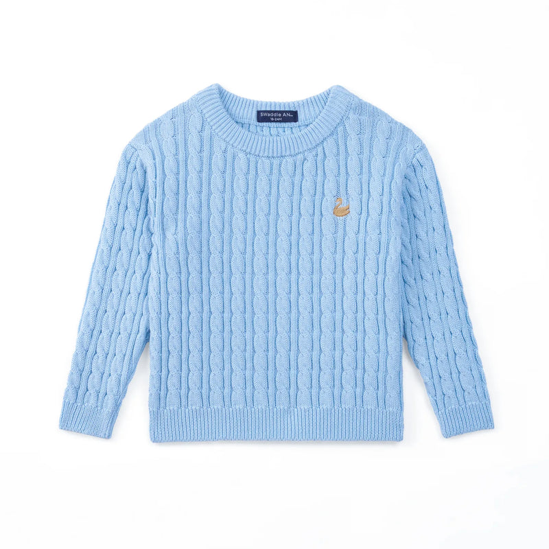Front view of baby blue cable knit sweater with ribbed cuffs and gold swan logo on chest