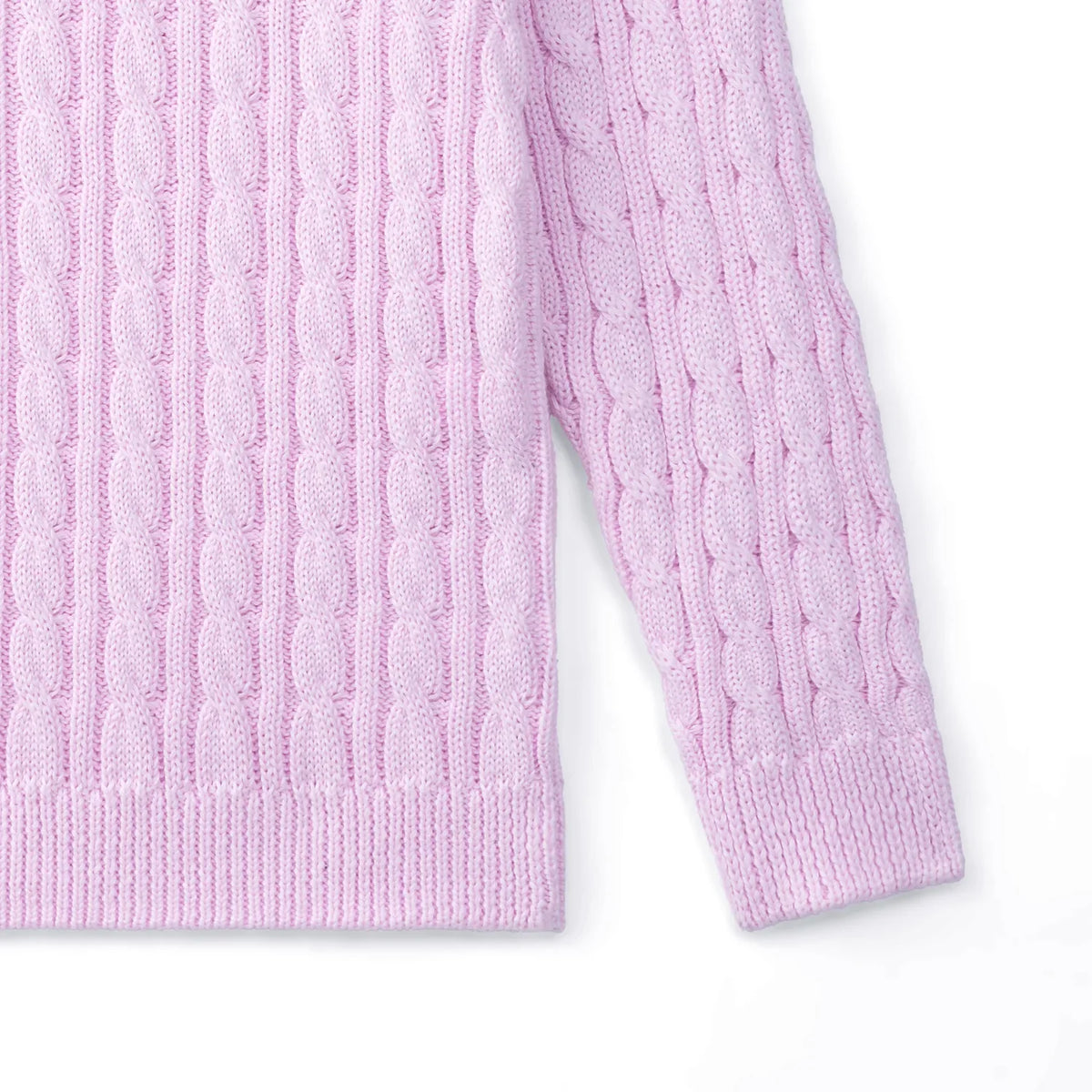 Detail of lilac baby sweater sleeve and hem showing continuous cable knit pattern and ribbed construction