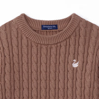 Close-up of mocha cotton sweater neckline showing navy size tag and white swan logo detail