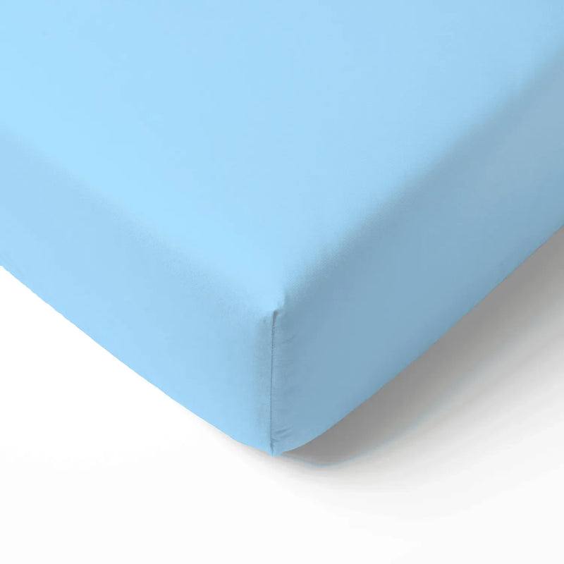 Close-up of light blue bamboo crib sheet corner with smooth texture and elastic seam