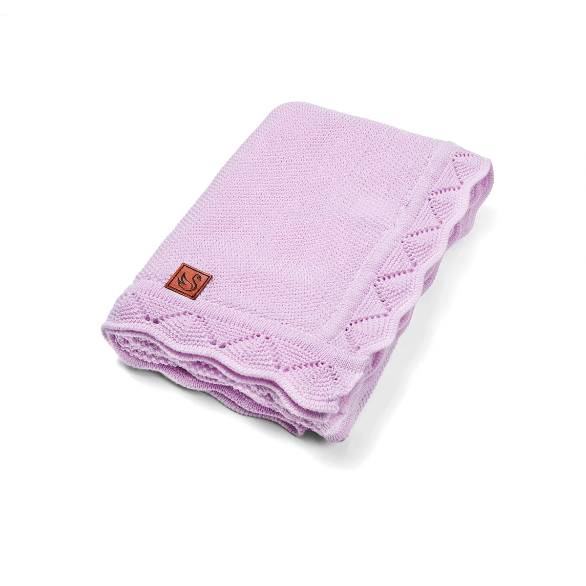 Folded lilac knit baby blanket with lace border and brown leather swan tag