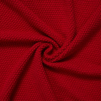 Spiral swirl of red knit textile demonstrating drape, flexibility, and uniform stitch detail