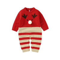 Happy toddler dressed in a cozy winter knit romper with a festive design, part of the 'Winter Sweeties' collection for joyful winter activities.