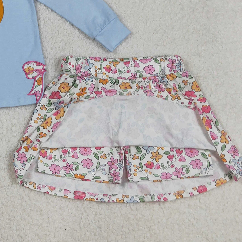 Inside view of the floral skort from the Pumpkin Fleurs Baby Girls' Embroidered Skort Outfit highlighting the built-in shorts for comfort.