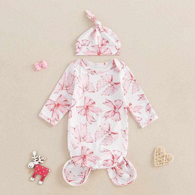 Baby Bows Knotted Infant Swaddle Gown 2 PC Set displayed on a soft background, highlighting its floral design and matching hat.