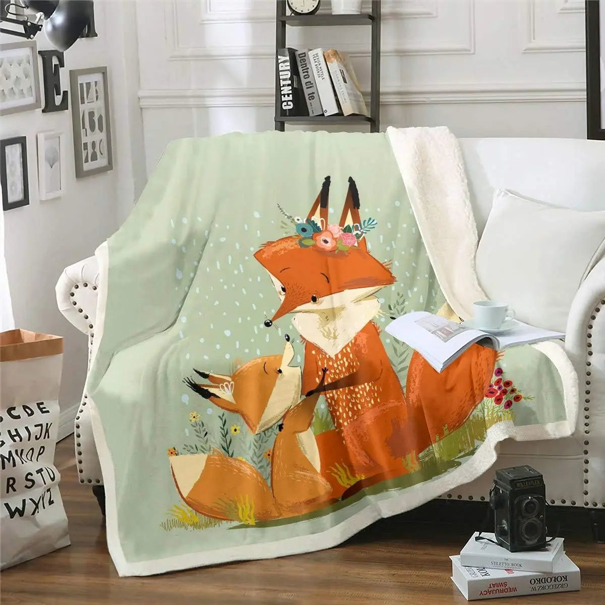 Jungle Rumble double-sided children's blanket featuring fox family with floral crown on mint-green background.