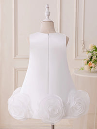 White dress with floral details on a mannequin against a neutral background