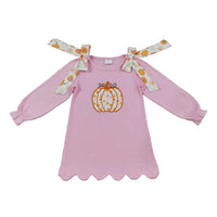 Cute pink long sleeve A-line dress with embroidered pumpkin and pumpkin print shoulder ties for fall.