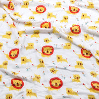 Two-layer bamboo cotton baby swaddle blanket with yellow lion pattern on white background.