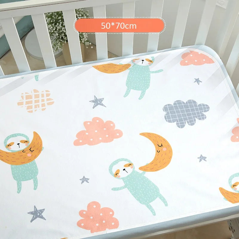 Children's waterproof changing pad cover with pastel sloth prints, moons and clouds on white fabric, 50x70 cm.