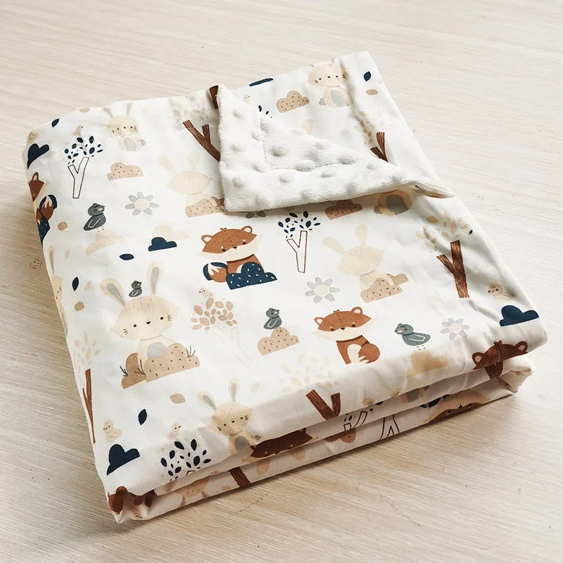 Dotted Minky Blanket in Colorful Prints, 100x75 cm, lightweight polyester/cotton, folded with woodland animals.