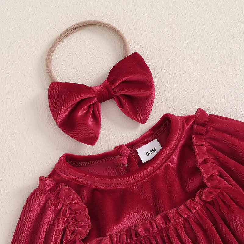 Close-up of the deep red bow accessory paired with the Velvet and Frills Holiday Baby Bubble Set, adding a stylish touch for baby girls.