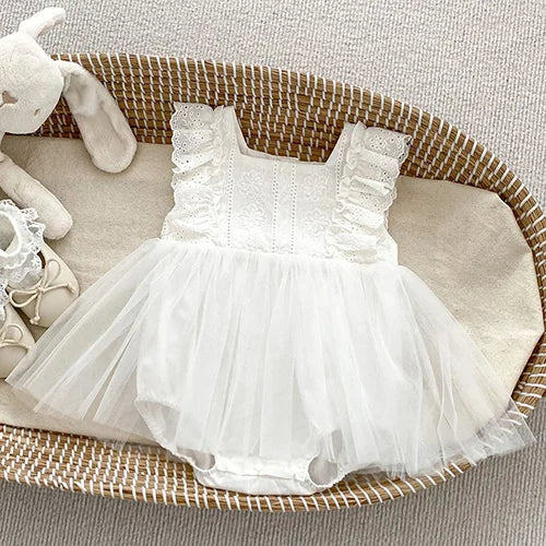 Charming white Spring Frills Baby Bubbles with frilly sleeves and embroidered flower design, perfect for casual outings and playtime.