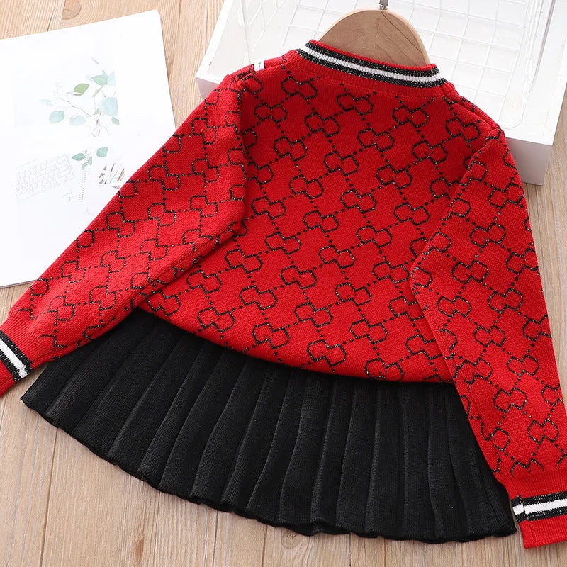 Back view of the red "Morgan" Classic Knit Skirt Set, highlighting the stylish sweater and pleated skirt design.