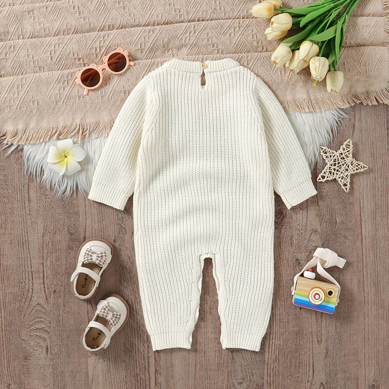 Back view of the Little Bow Peep Crocheted Knit Baby Romper in cream, featuring button closures, ideal for a practical knit baby outfit.