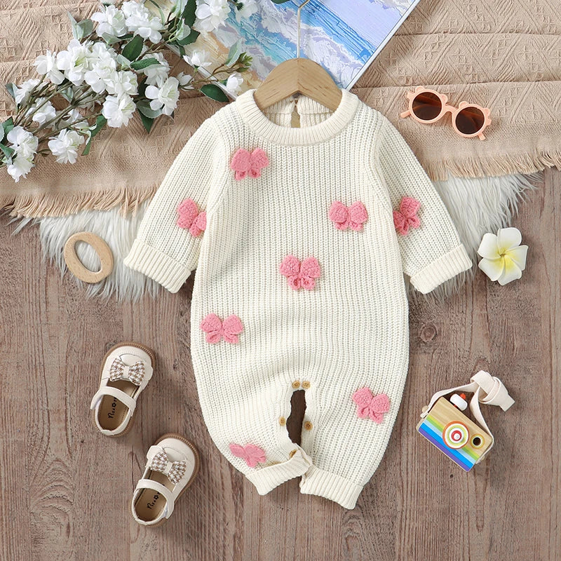 Little Bow Peep Crocheted Knit Baby Romper featuring a cream color with pink crochet bow accents, perfect for a cozy knit baby outfit.