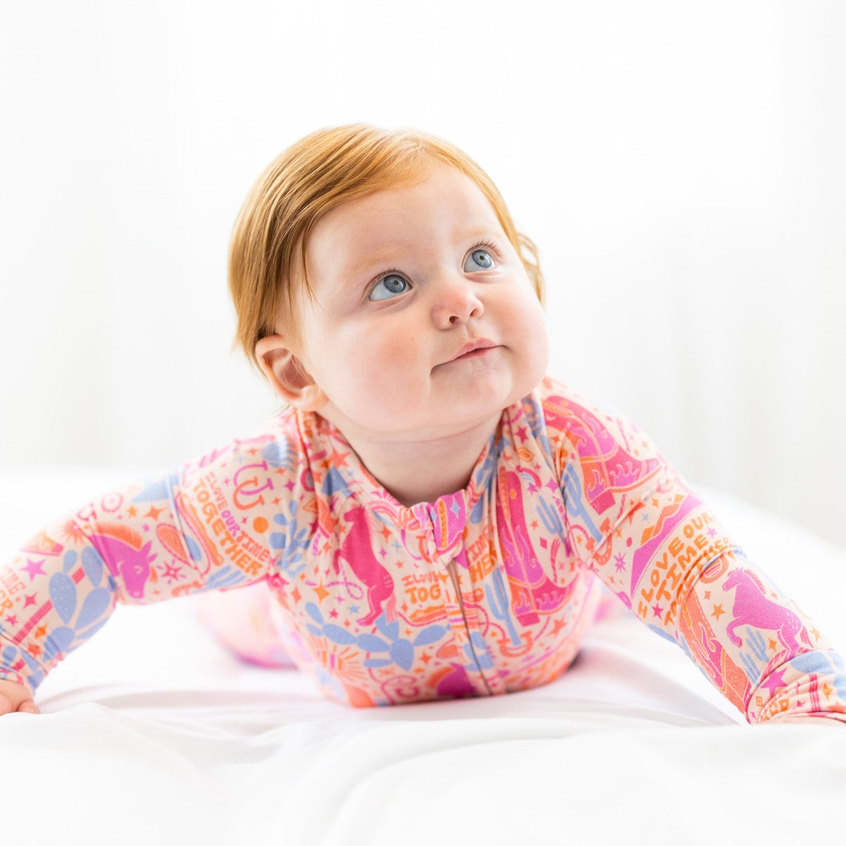 Baby wearing The Second-Skin Convertible Romper in Saddle Up, buttery soft Raising Mama viscose from bamboo.