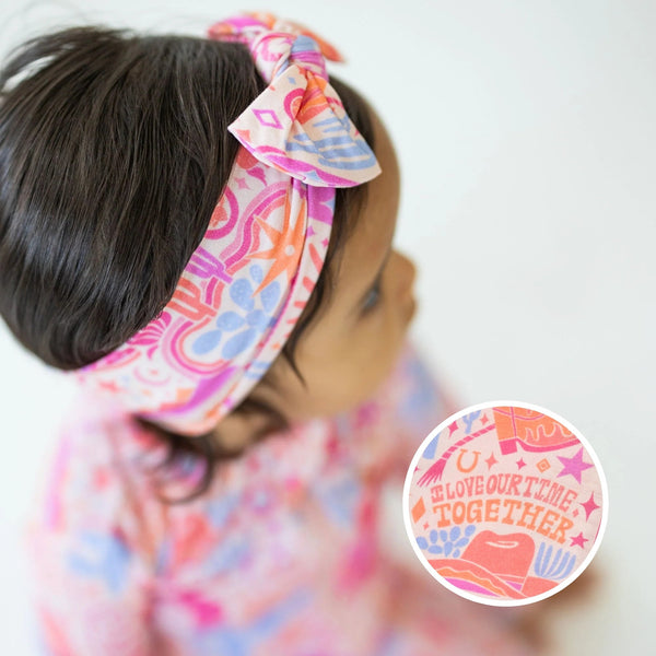 The SoftKnot Bamboo Baby Bow | Saddle Up - Adorable bamboo baby bow in a western-themed design suitable for infants.