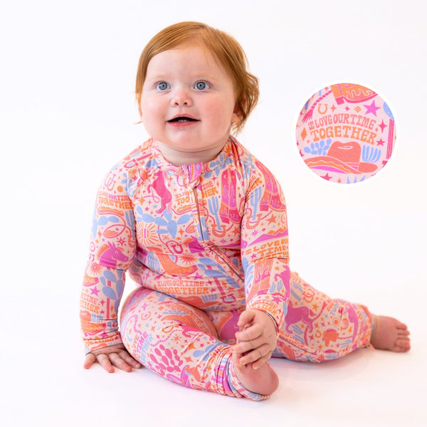 Baby in The Second-Skin Convertible Romper Saddle Up; pastel printed zip romper, buttery viscose from bamboo.