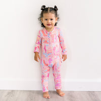 Baby wearing the Second-Skin Footless Romper | Saddle Up Western Themed enjoying playful moments, a cozy bamboo baby romper perfect for little explorers.