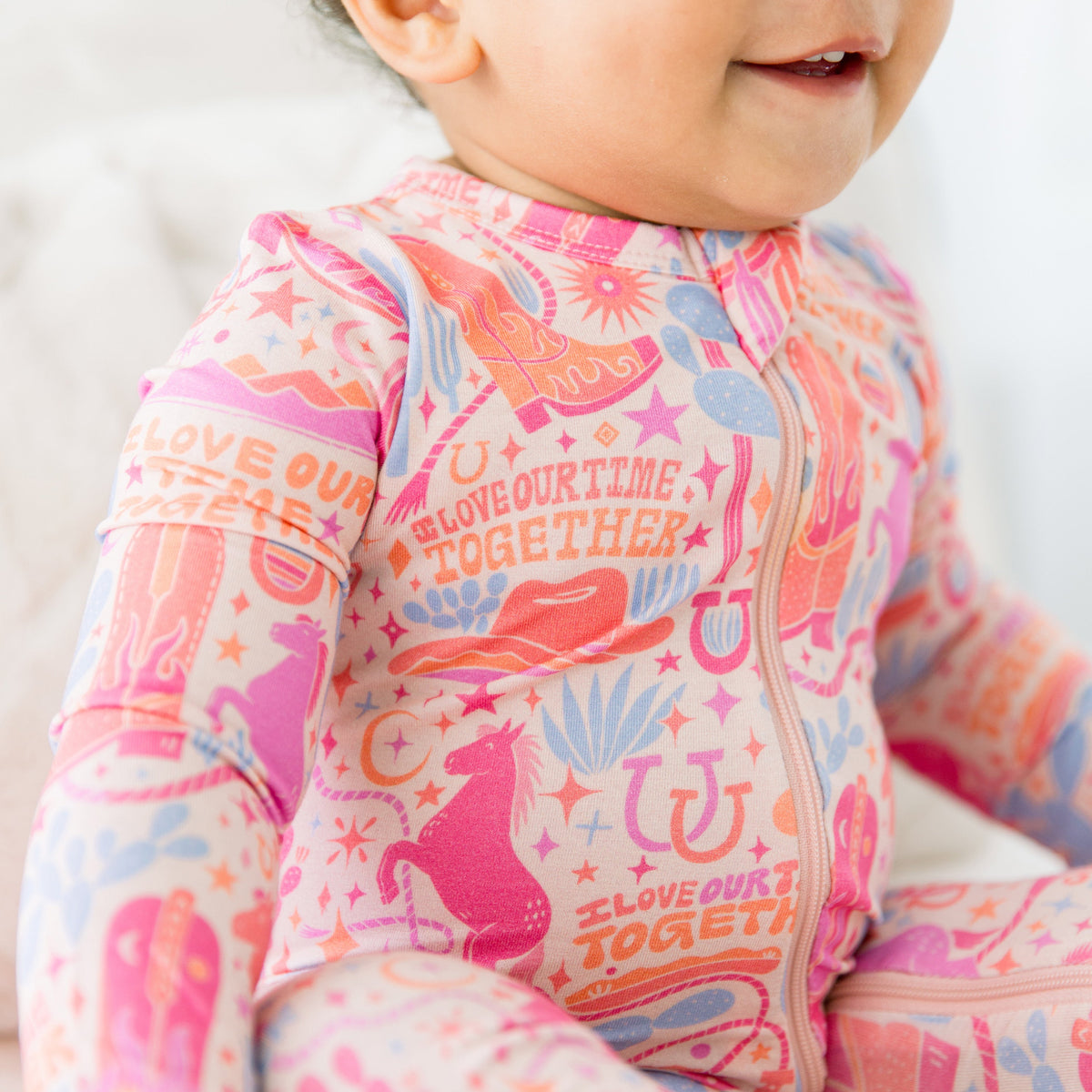 Detailed view of the zipper closure on the Second-Skin Footless Romper | Saddle Up Western Themed, highlighting the convenience of this bamboo baby romper.
