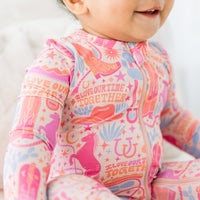 Detailed view of the zipper closure on the Second-Skin Footless Romper | Saddle Up Western Themed, highlighting the convenience of this bamboo baby romper.