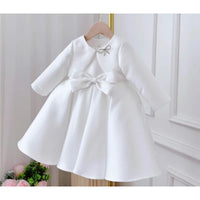 Patience Marie elegant beaded occasion dress for girls, knee-length white satin with waist bow and long sleeves.